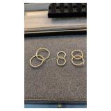 Three pair 14 karat gold earrings 8.2 g