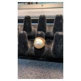 14k gold tested ring with large pearl like Stone