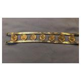 14k tested gold bracelet with seven Mexican two