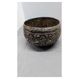 Ornate silver like bowl with animal figures