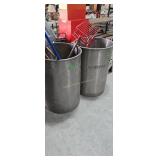 large metal pots with yard tools