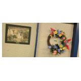 frame print of an outdoor scene and wreath
