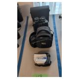 Sony handycam and binoculars as shown