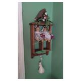 small wall shelf with dolls etc