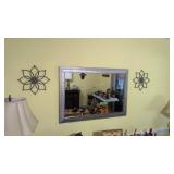 large framed beveled mirror with pinwheel