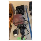 Canon EOS rebel camera and binoculars