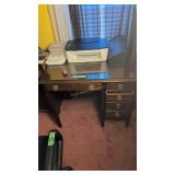 desk with printer and speaker