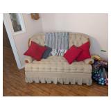 rocking loveseat with Afghan and pillows 56 in