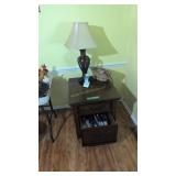 and table with table lamp books etc