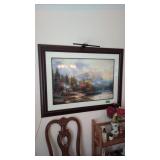 large framed print of a mountain scene with pond