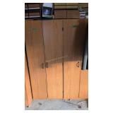 two double door storage cabinets VHS tape s