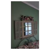 framed wall mirror with dolls on the top mirror