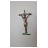 items on wall religious figure candle holders