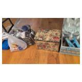sewing boxes etc located under table