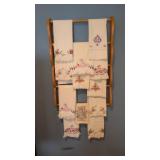 wall rack with embroidered pillow cases and box