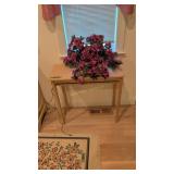 small stand with decorative plant