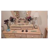 figural vases lamp items on top of dresser