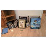 lot of artwork and framed prints