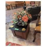 small stand with artificial plant