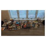 lot of hard back and paperback books as shown