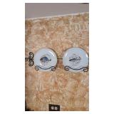 four fish plates on wall