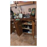 items on shelf and in cabinet figurines plates