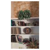 items on bookshelf woven basket books etc