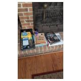 books and games on fireplace