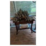 oak library table with artificial plants