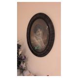 oval frame picture of a lady 24 in tall