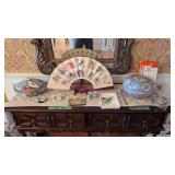 Oriental covered bowls fan etc on top of server