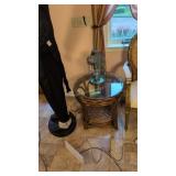 round glass top rattan table with bird feeder