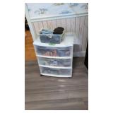 plastic cabinet with scarves etc