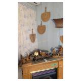 carved wooden figures on fireplace and hand fans