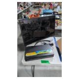 LG 30-in flat screen TV with Samsung DVD VHS
