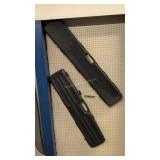 pair of hard plastic gun cases 47 and 51 in