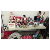 lot of Christmas decorations on and under table