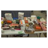 lot of miscellaneous reloading supplies on table