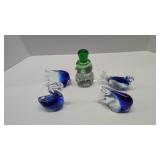five glass paper weights as shown