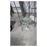 metal stand with the birds and wrought iron stands
