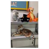 tiger with cub and other stuffed animals as shown