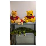Winnie the Pooh and large alligator stuffed