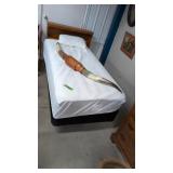 single bed with clean bedding