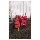 lot of gas cans various sizes