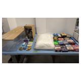 VHS tapes, blanket, doll, display cases