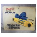 Monroe Shocks & Struts Embossed Tin Sign