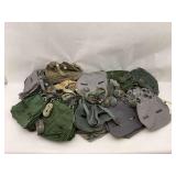 Pile of Military Style Canvas Bags and Straps