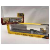 Collection of Diecast Scale Model Trucks: CAT CT660, 1948 Peterbilt, and CAT Excavator
