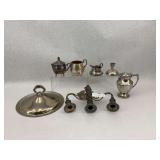 Group of Silverplate Items Including Creamers, Candle Holders, and Candelabra