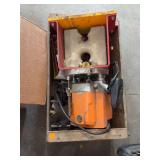 Heavy Duty Orange and Red Power Tool in Wooden Crate
